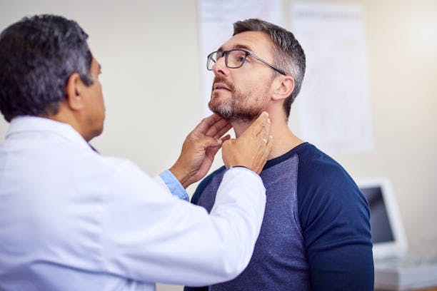 Man Getting a Neck Exam
