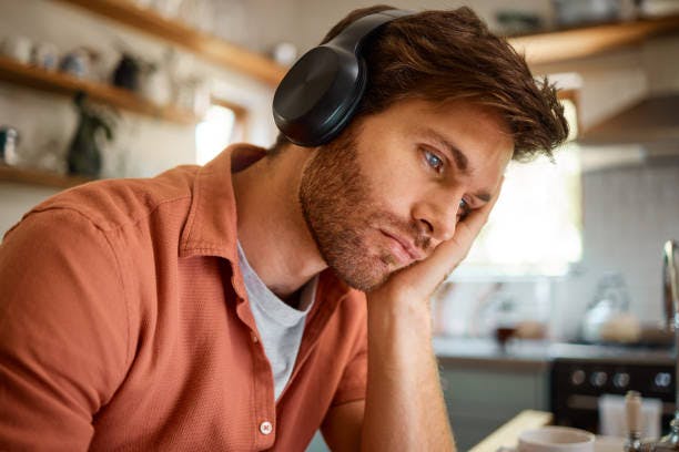 Tired Man with Head Phones