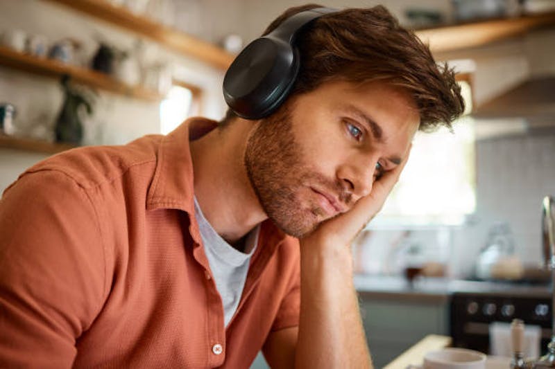 Tired Man with Head Phones