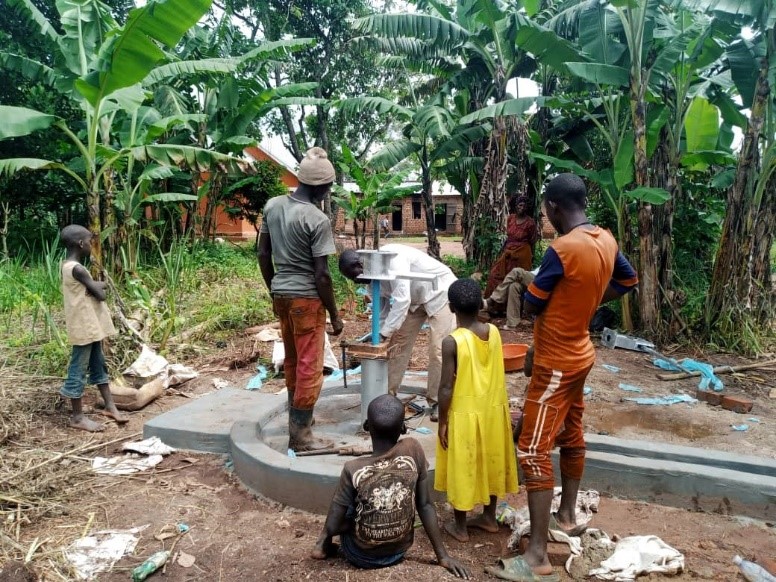 Uganda family at borehole