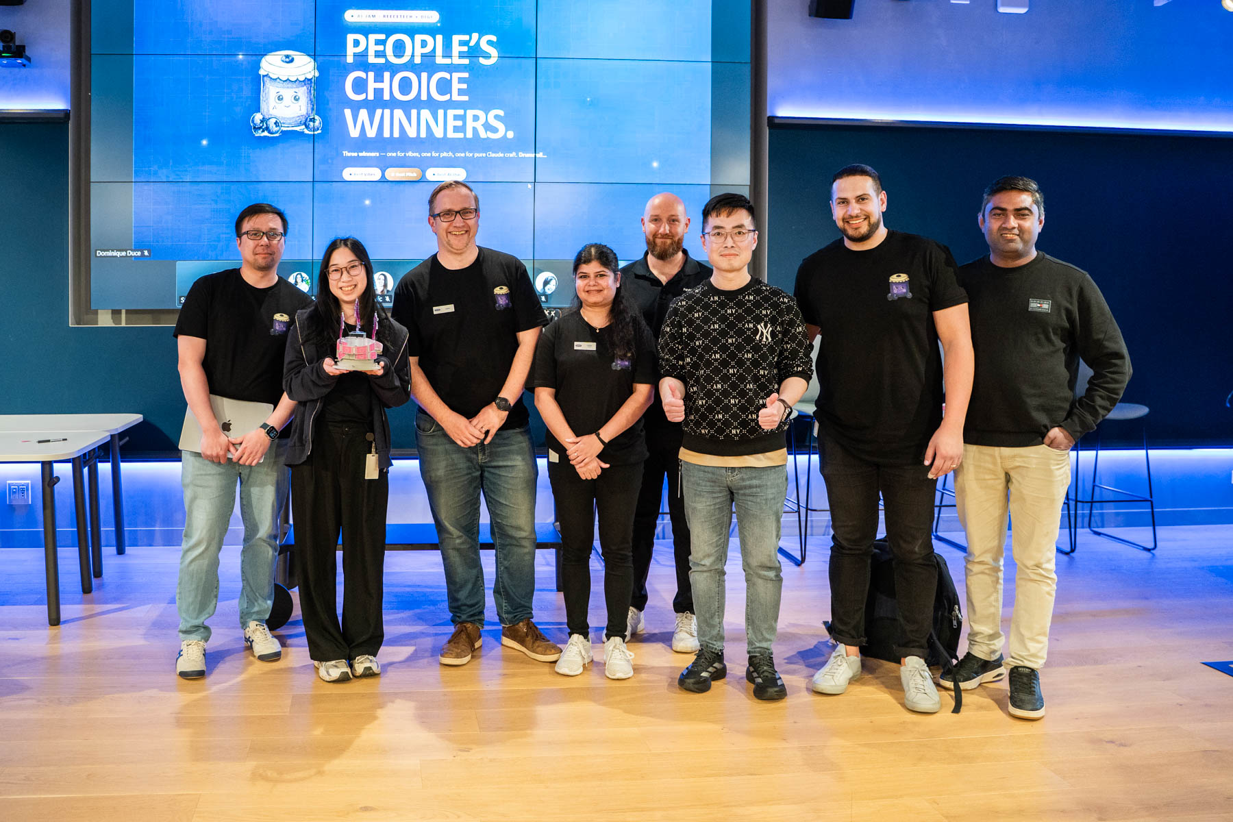 Team holding their trophy for the Peoples Choice