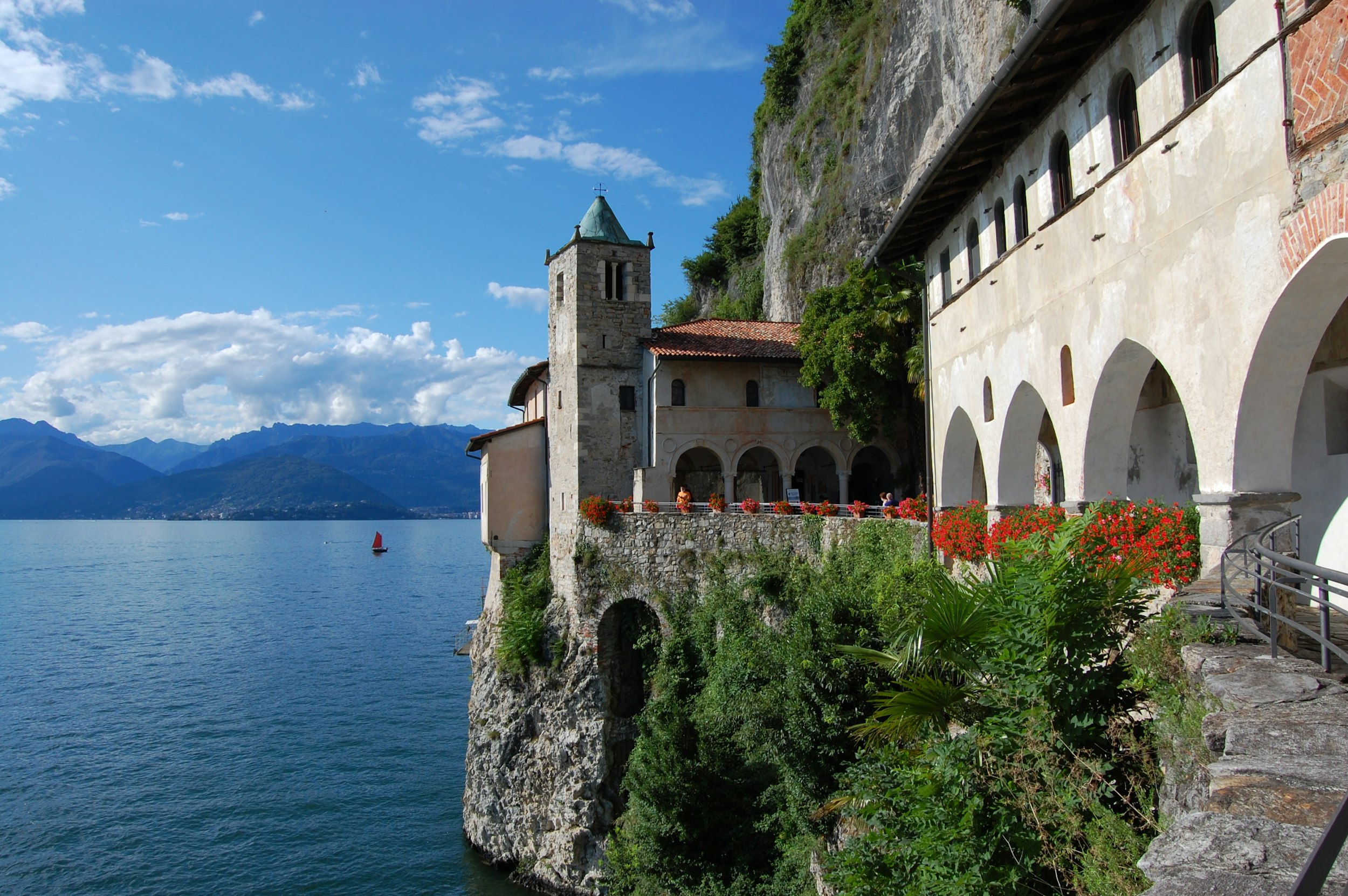 a building on the edge of a cliff overlooking a body of water
