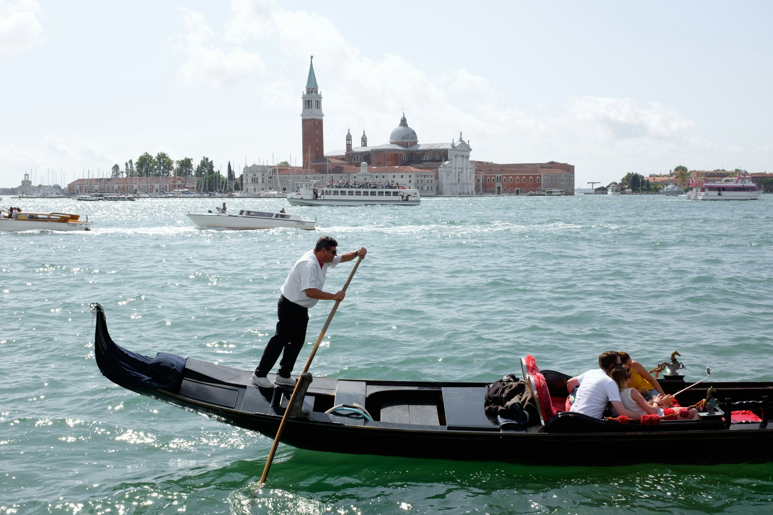 people riding on boat on river during daytime