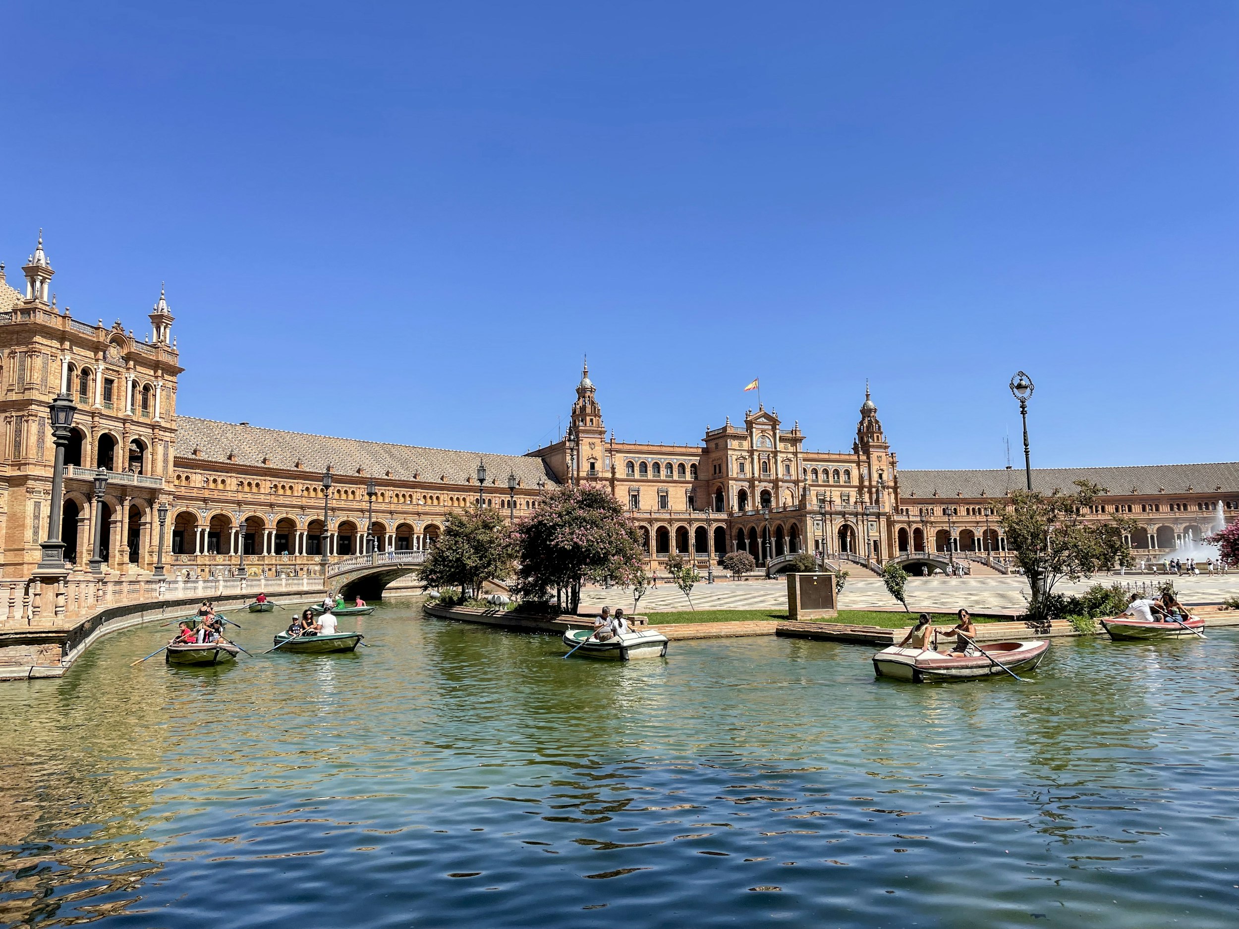 a large building sitting next to a body of water