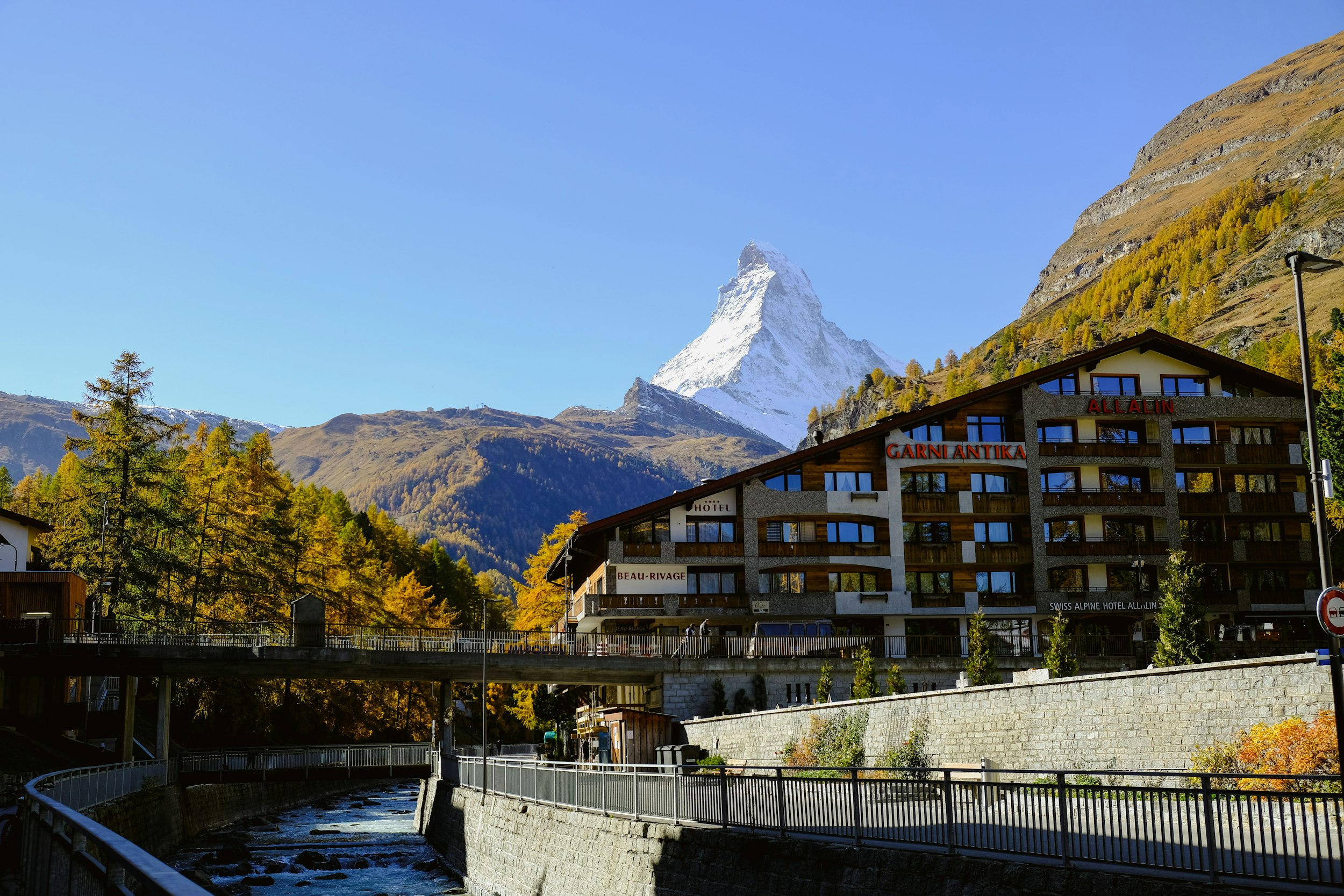 a building with a mountain in the background
