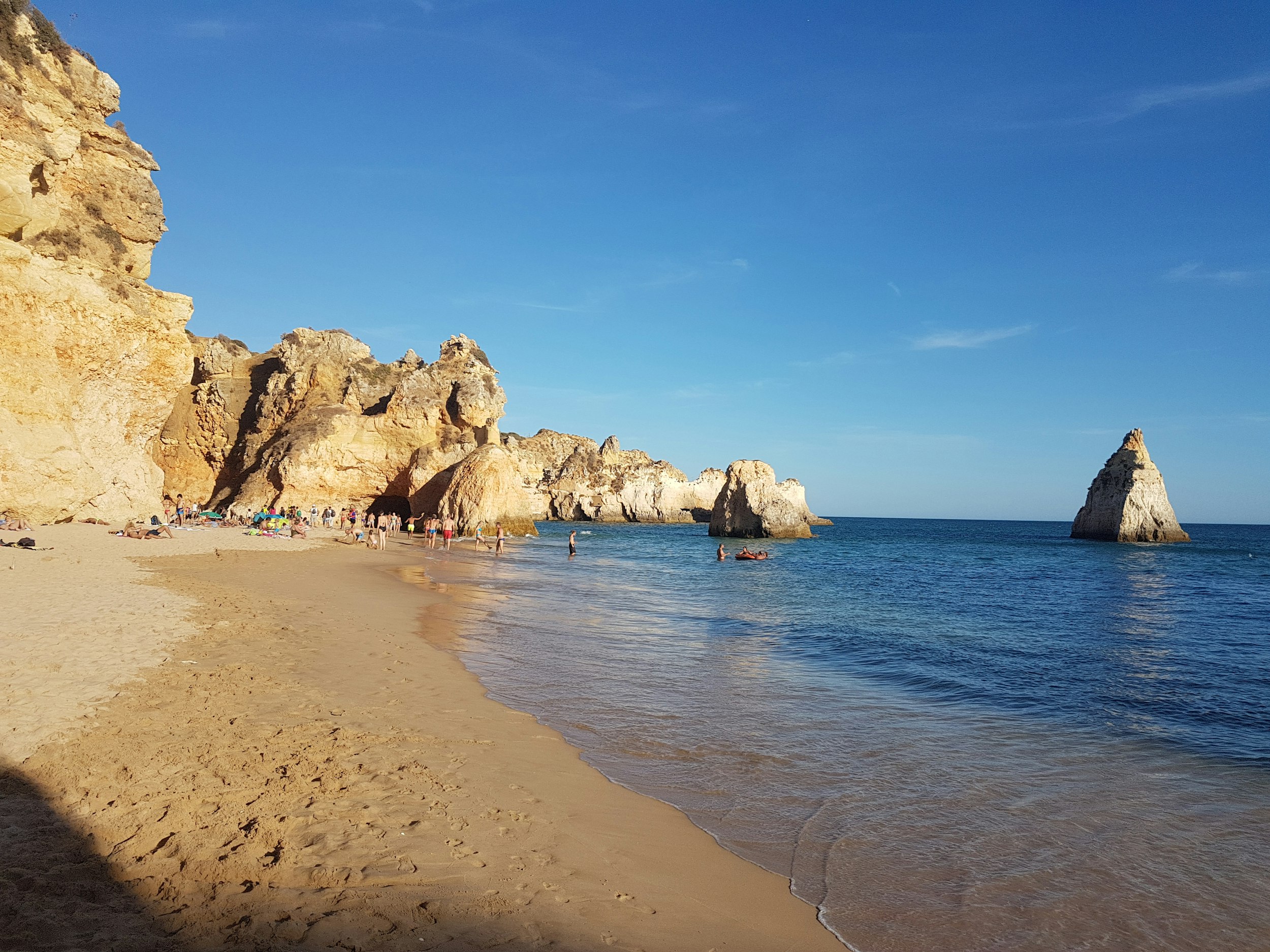 brown rock formation on sea shore during daytime