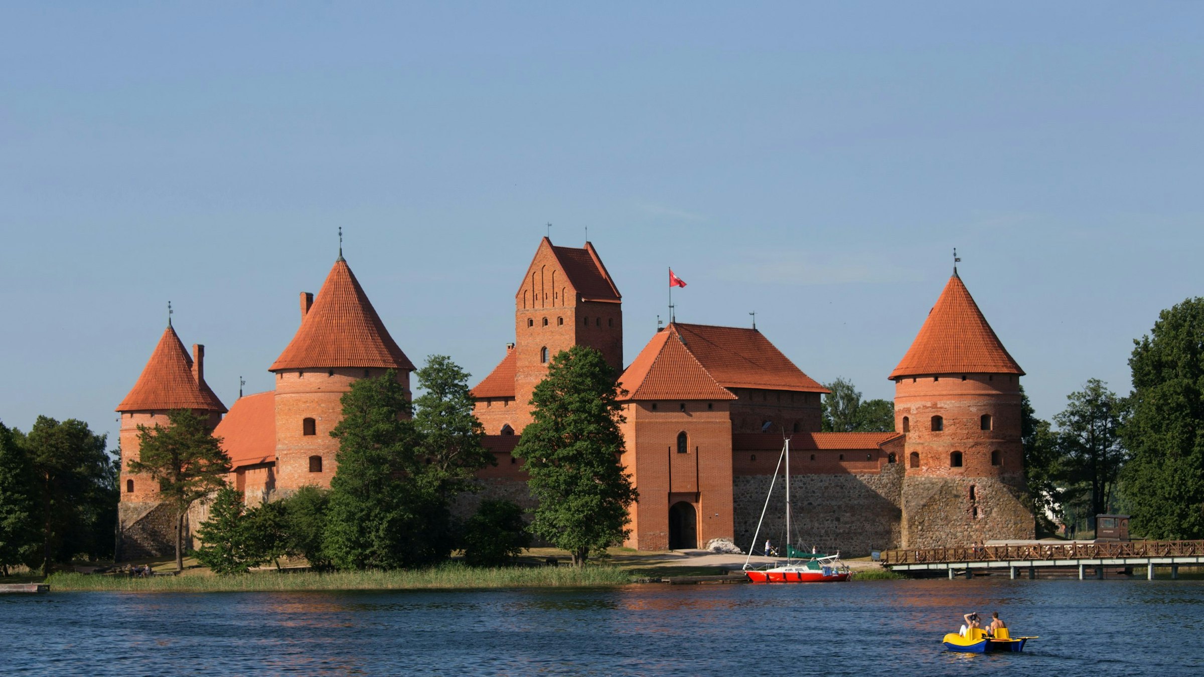 Red-brick turrets of Trakai Island Castle rise above the water, Lithuania