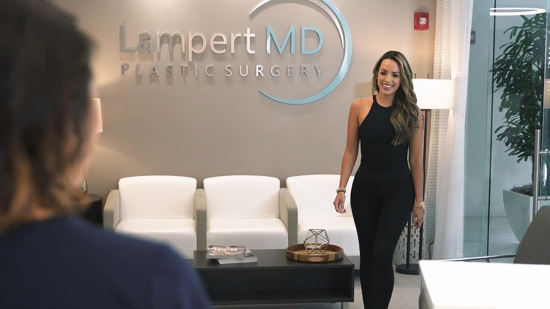 Miami breast explant patient walking into the Lampert MD practice
