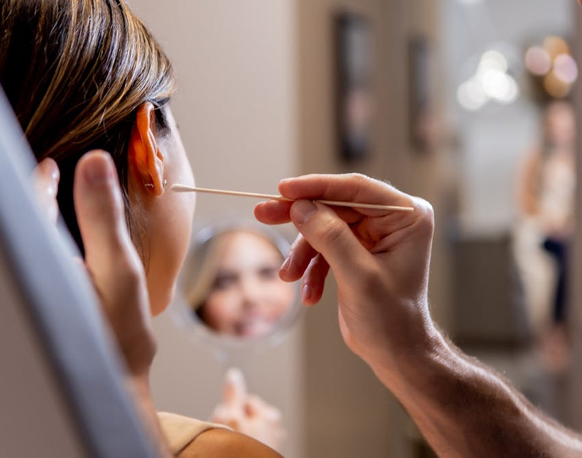 Woman's face being examined by a doctor