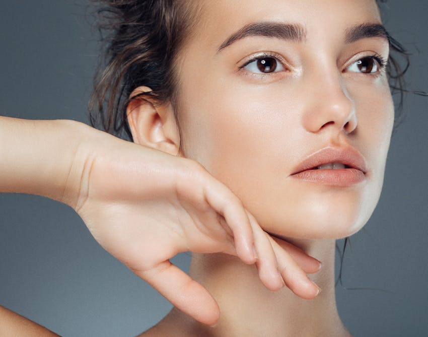 Brown-haired woman staring off into the distance