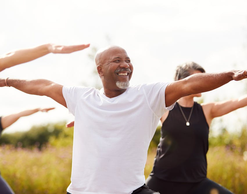 Older african american man doing yoga