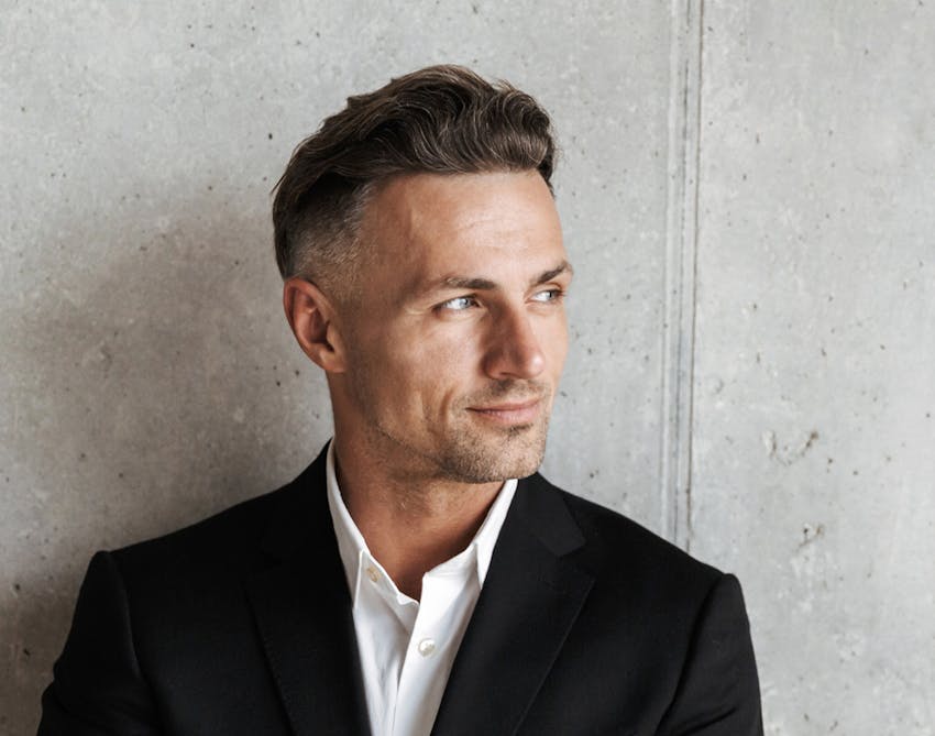Nicely-dressed man in a black and white suit
