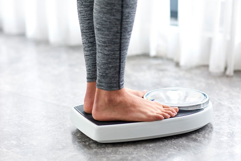 someone standing on a scale