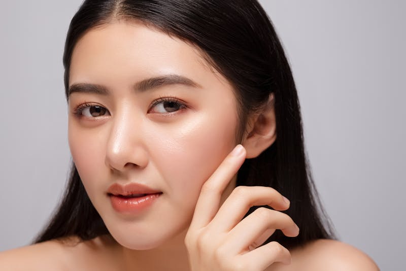 a woman with a hand on her face