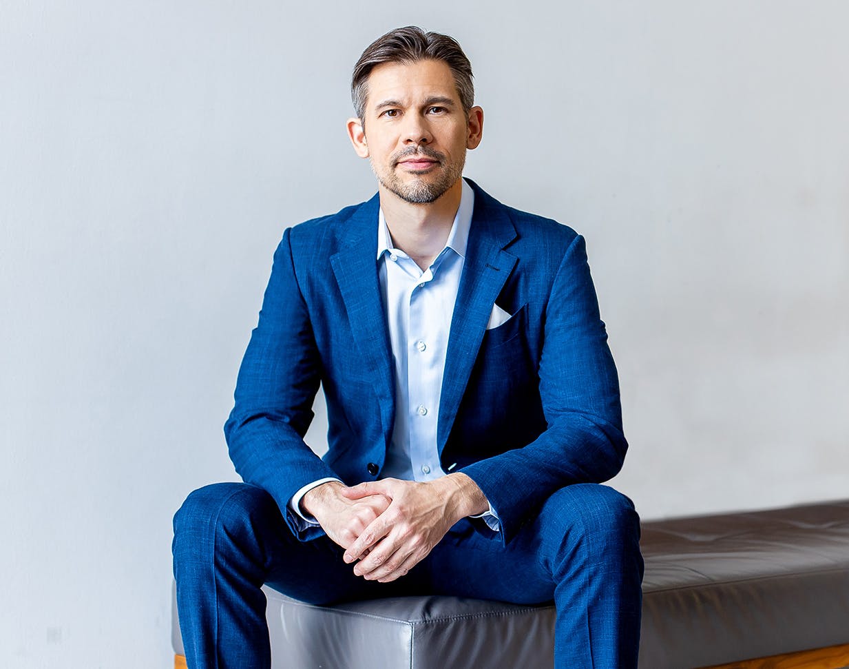 Dr. Joshua Lampert sitting on a bench