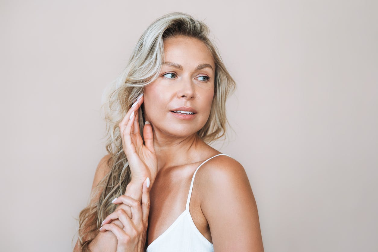 Woman with blonde hair looking to the side