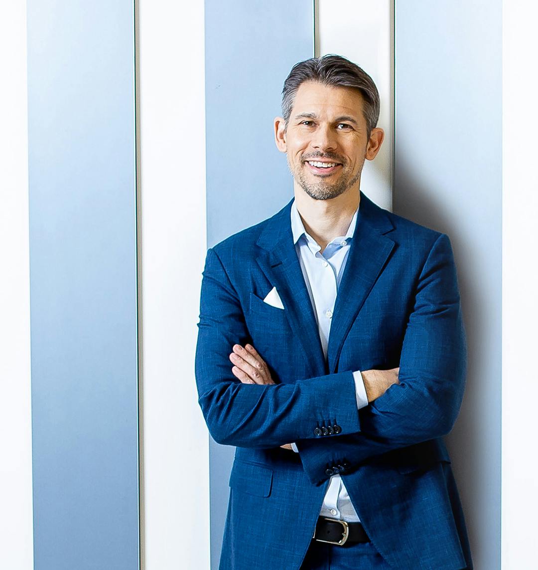 Dr. Lampert in a blue suit