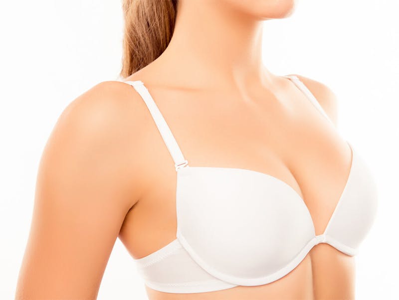 woman in a white bra with a ponytail