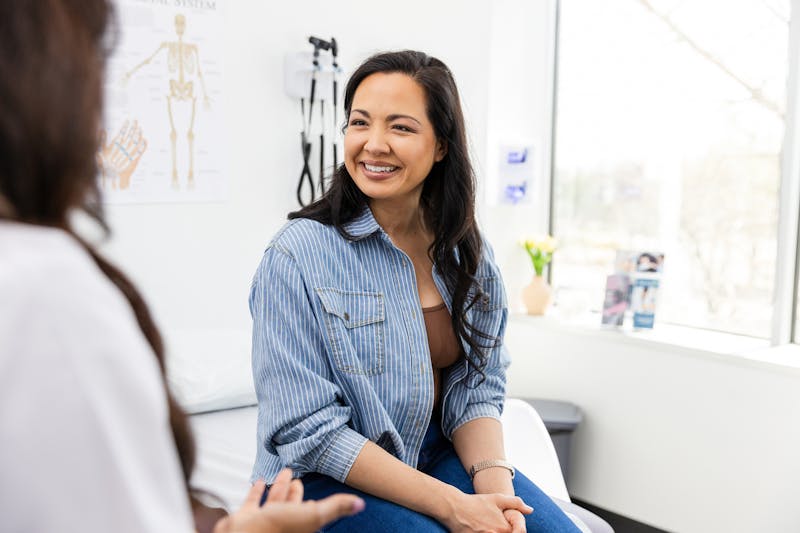 Woman speaking with doctor