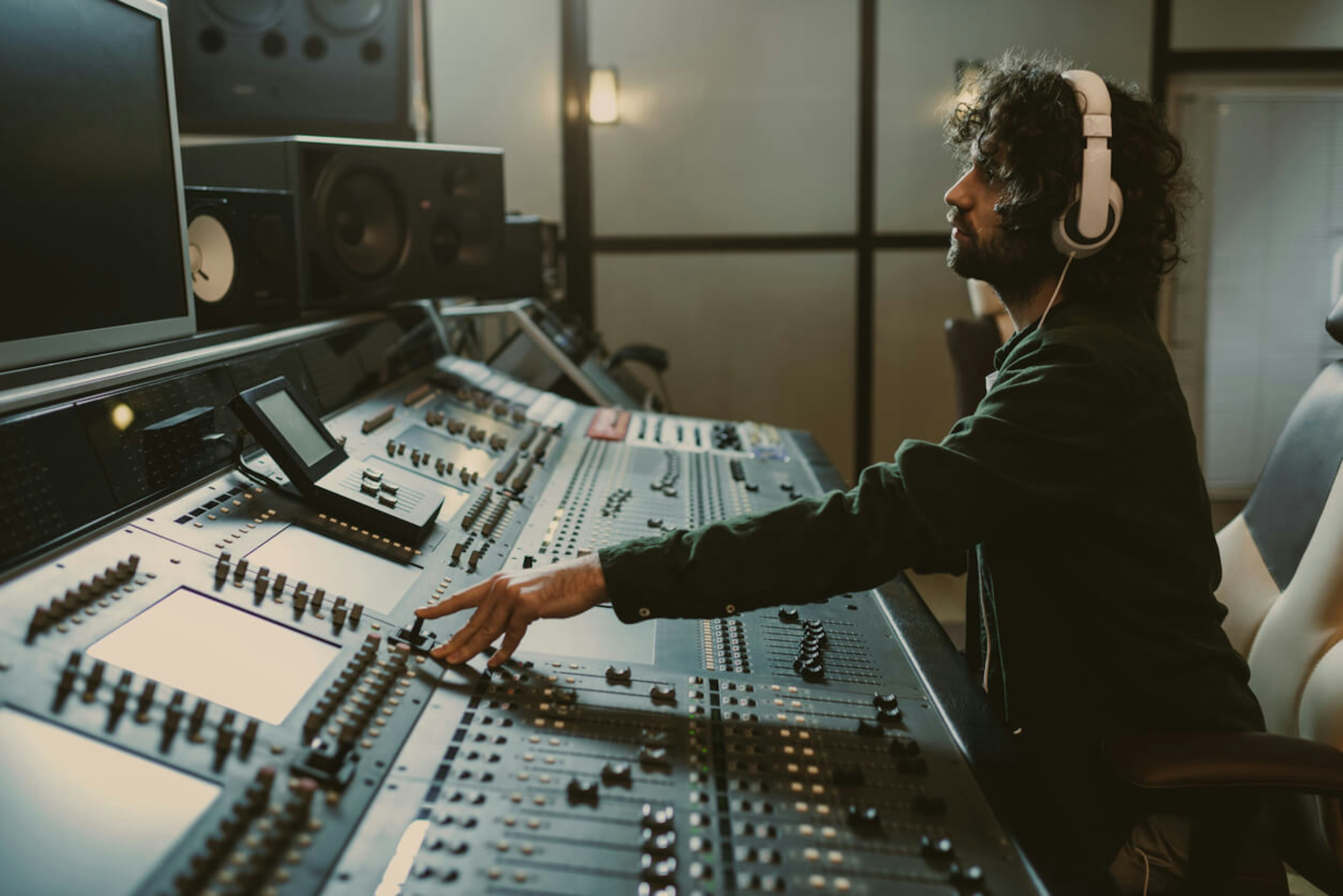 Recording Artist works hard in the studio to create new music