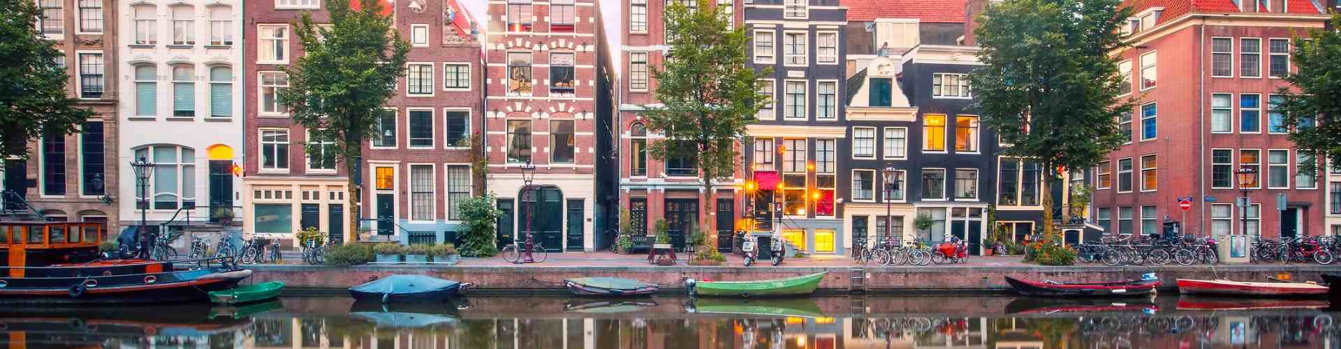 A row of houses and shops along the canal in Amsterdam