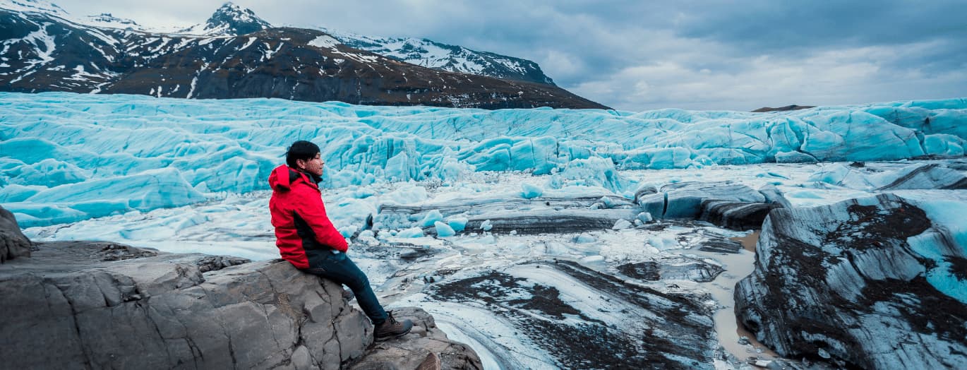 Boy looking out at a glacier on a school trip to Iceland