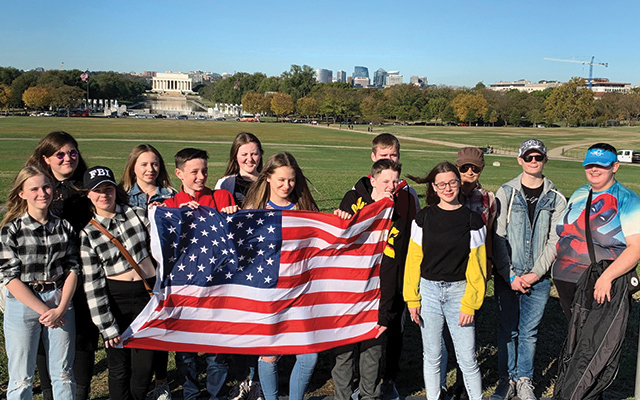 Images of students holding an American flag