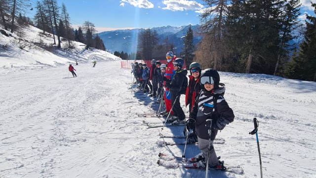 Line up of skiiers