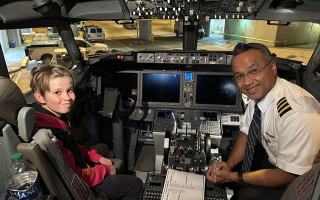 Student inside aircraft cockpit with pilot Student inside aircraft cockpit with pilot