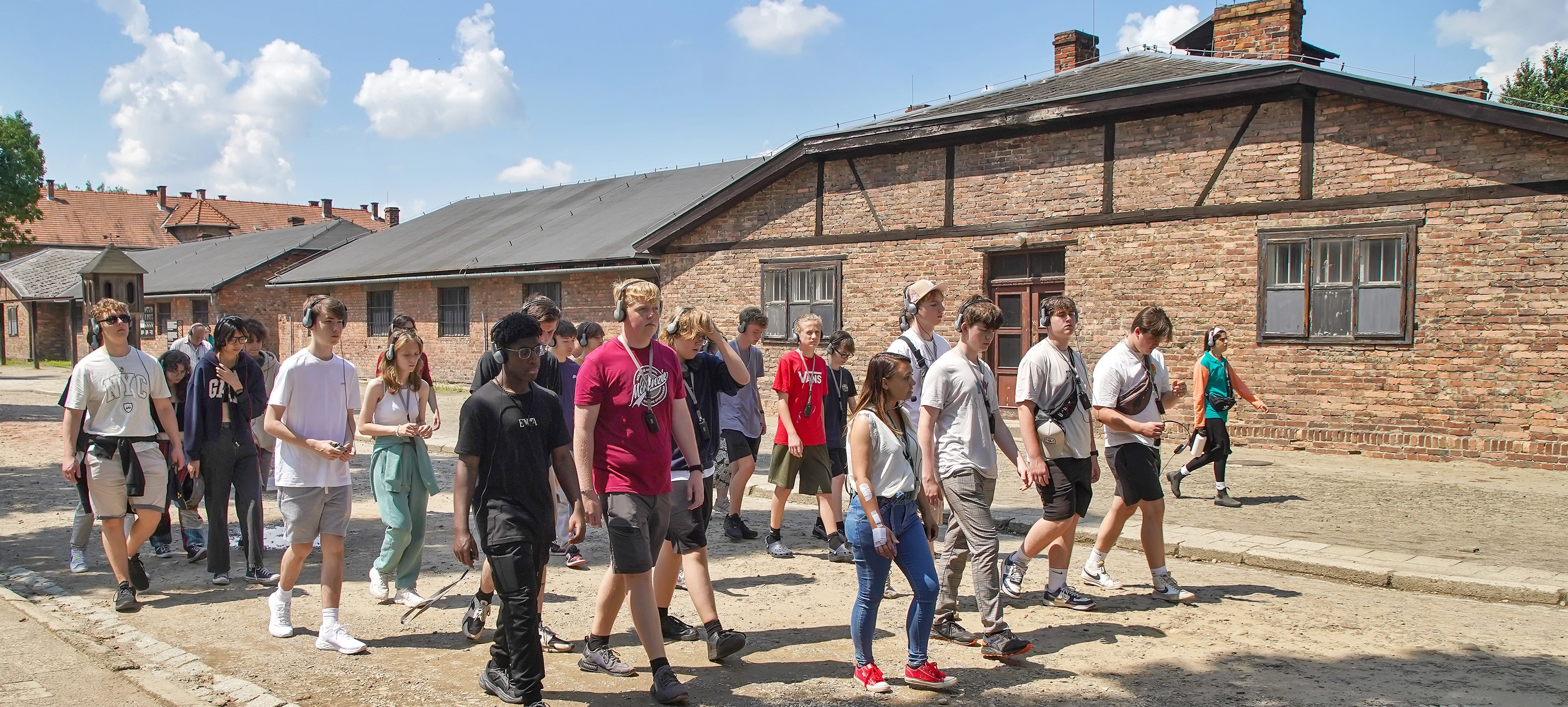 School students walking through Auschwitz