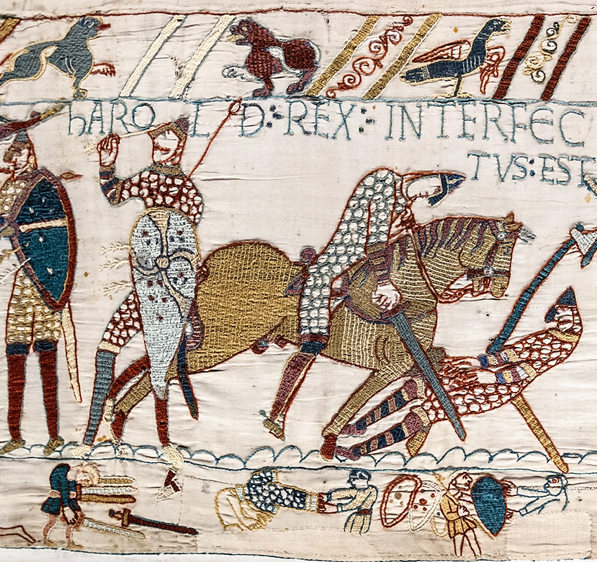 A close up of a section of the bayeux tapestry