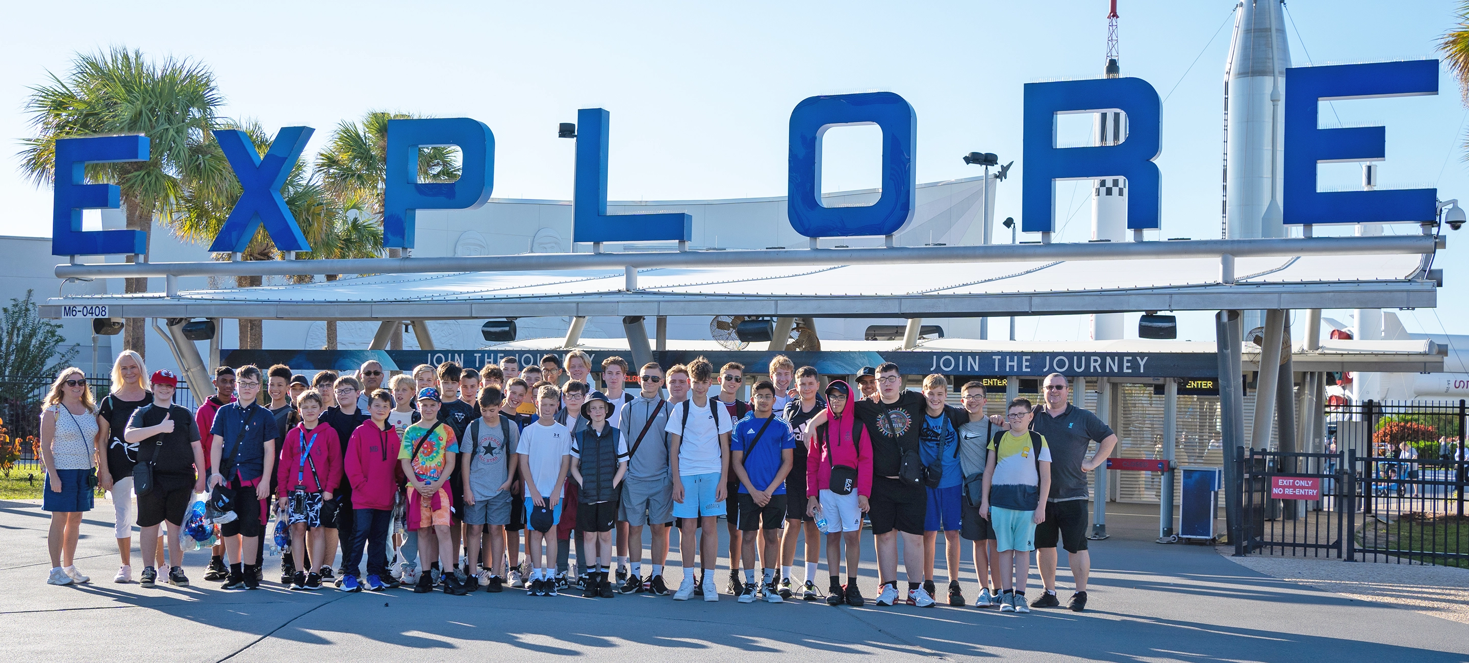 A school group stand in front of the Kennedy Space Centre, USA