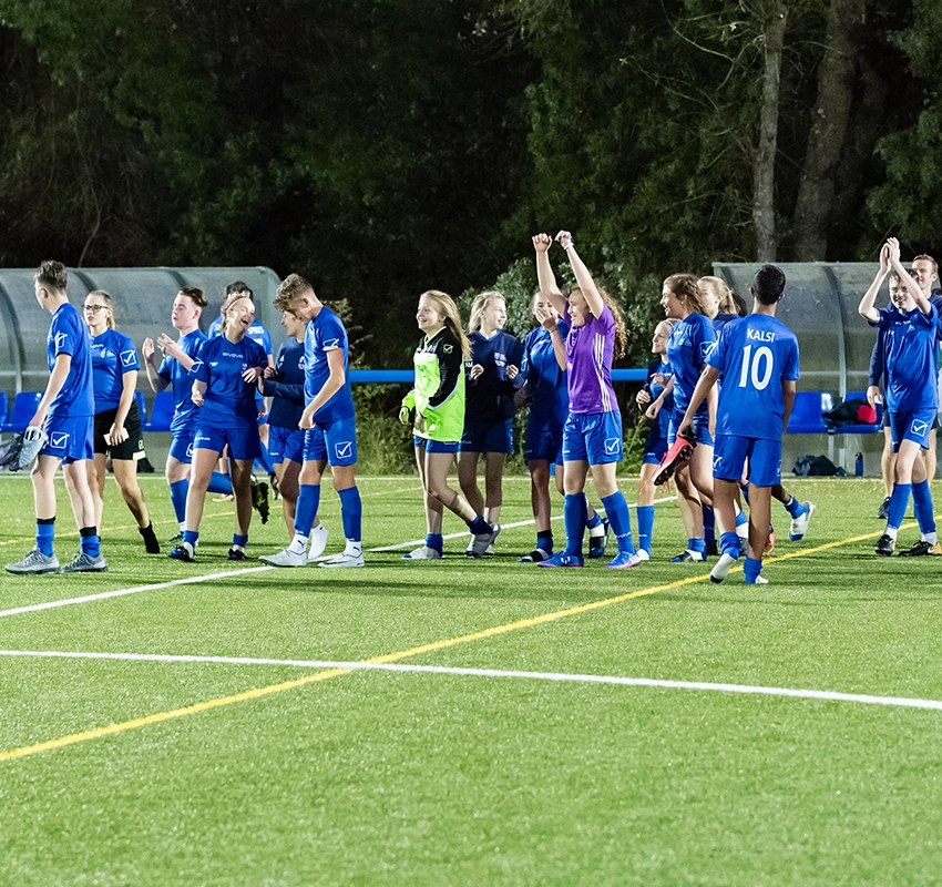 A school football team celebrating their win