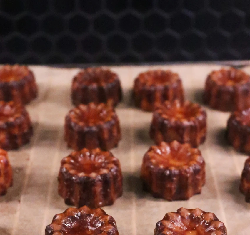 View of tray of Canelés which are traditional cinnamon flavoured cakes from Bordeaux
