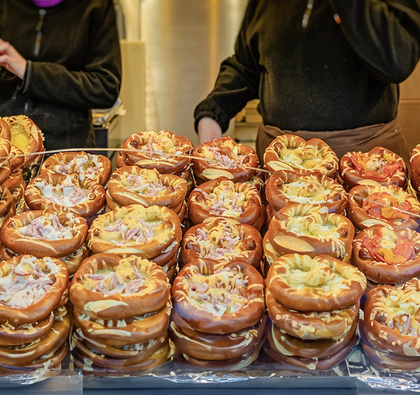 Stuffed pretzels with cheese on a market stall
