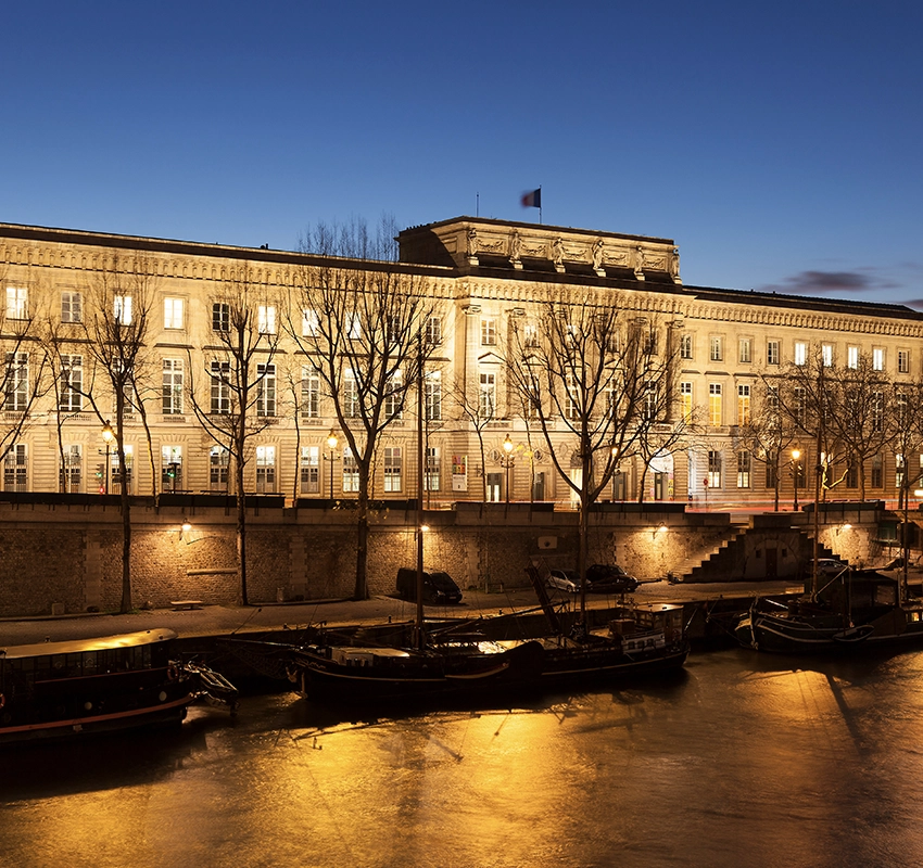 Monnaie de Paris building illuminated at night