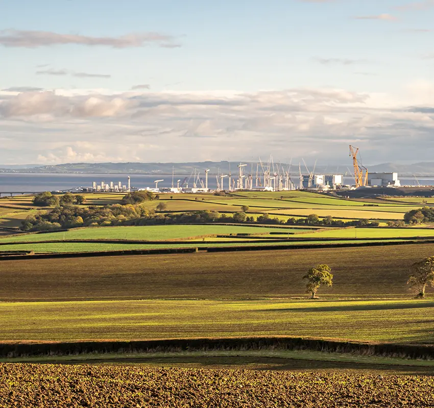 View of power station from across green fields