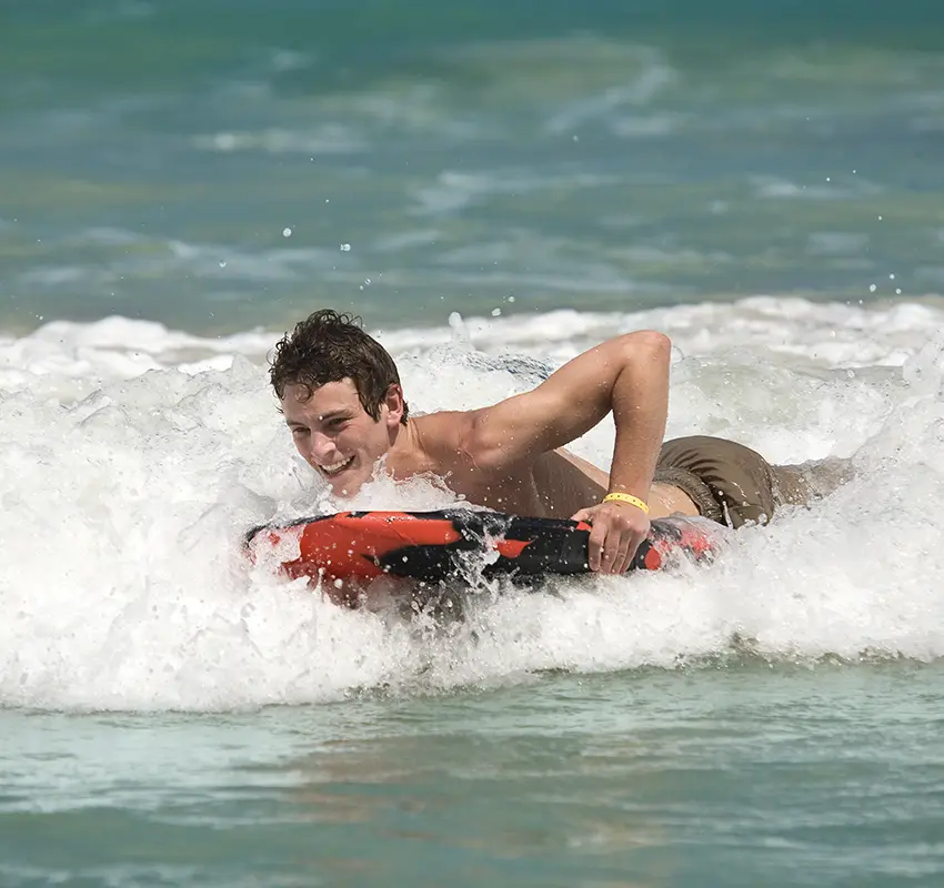 Young man bodyboarding