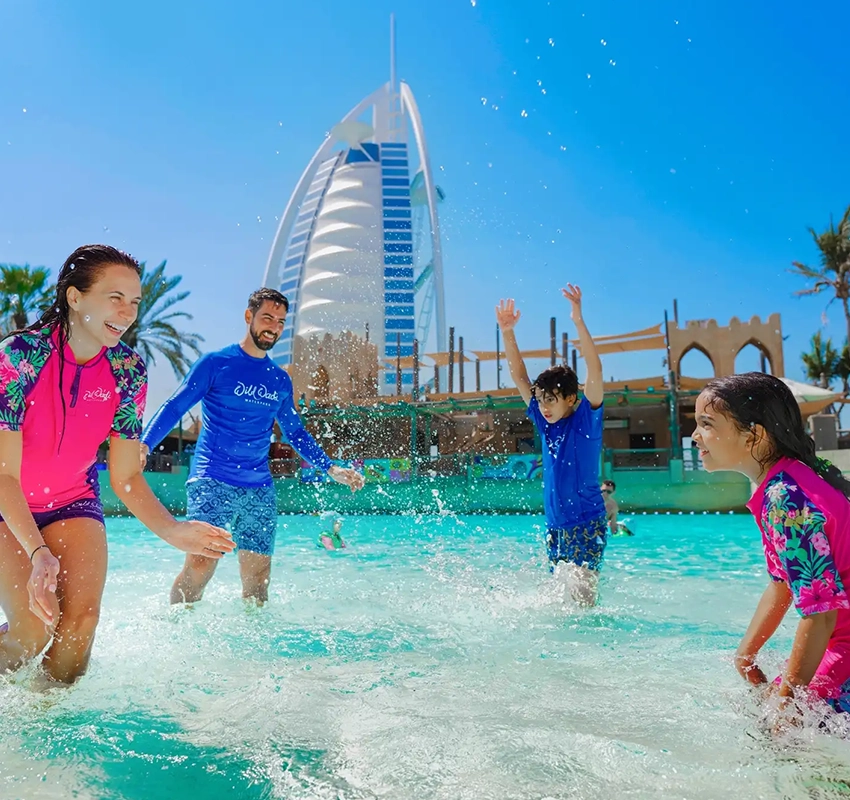 A family playing in a pool at Wild Wadi Water Park