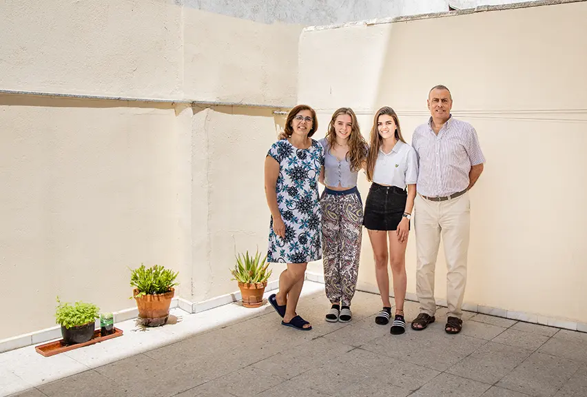 Language students with a host family on a sunny day