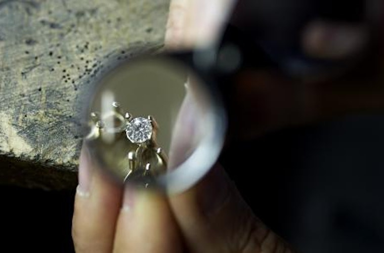 focus of a detail of  a ring with diamond