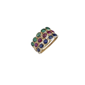 Gold rings with color stones on a white backgrounds