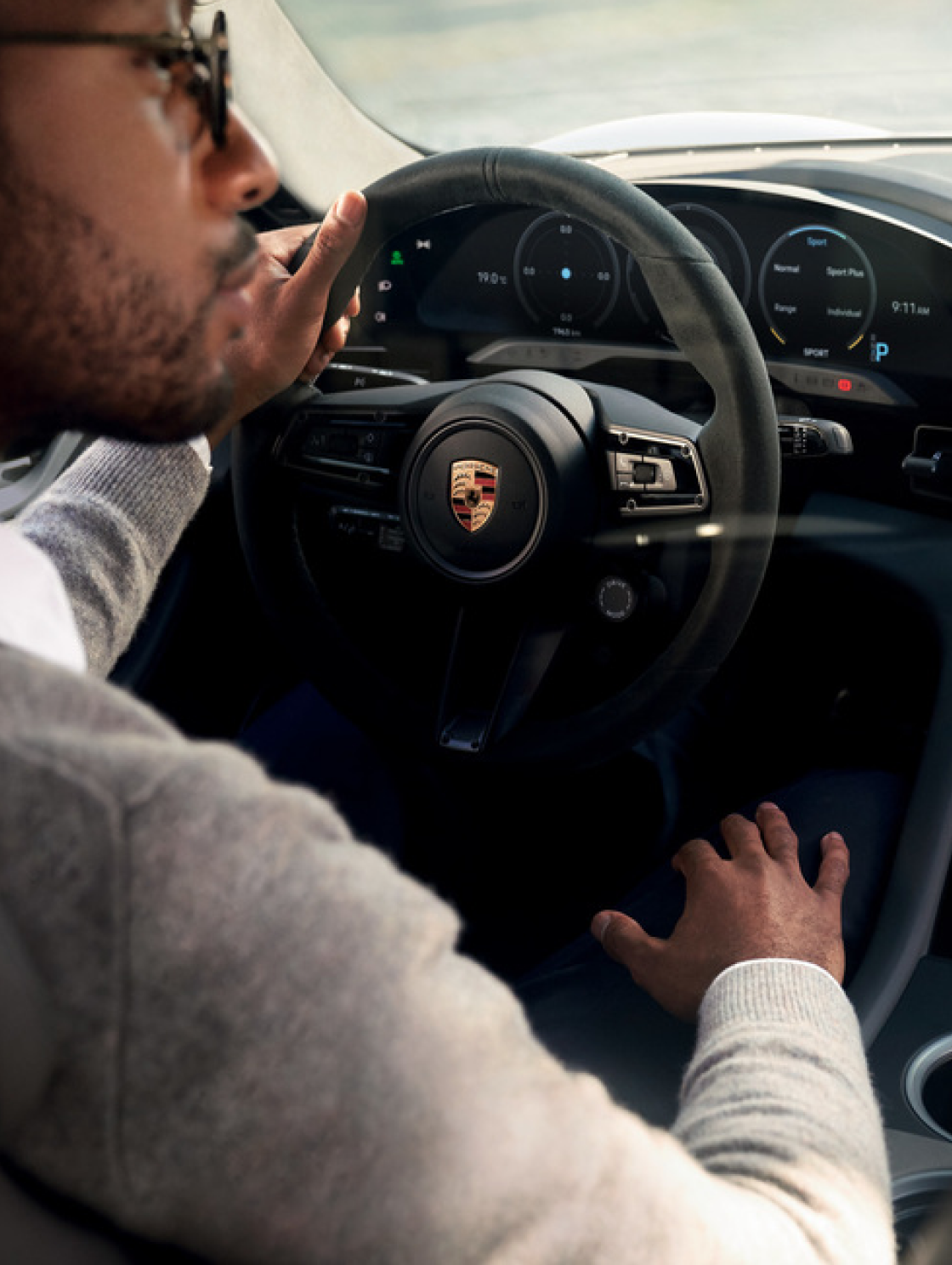 Man behind Porsche wheel