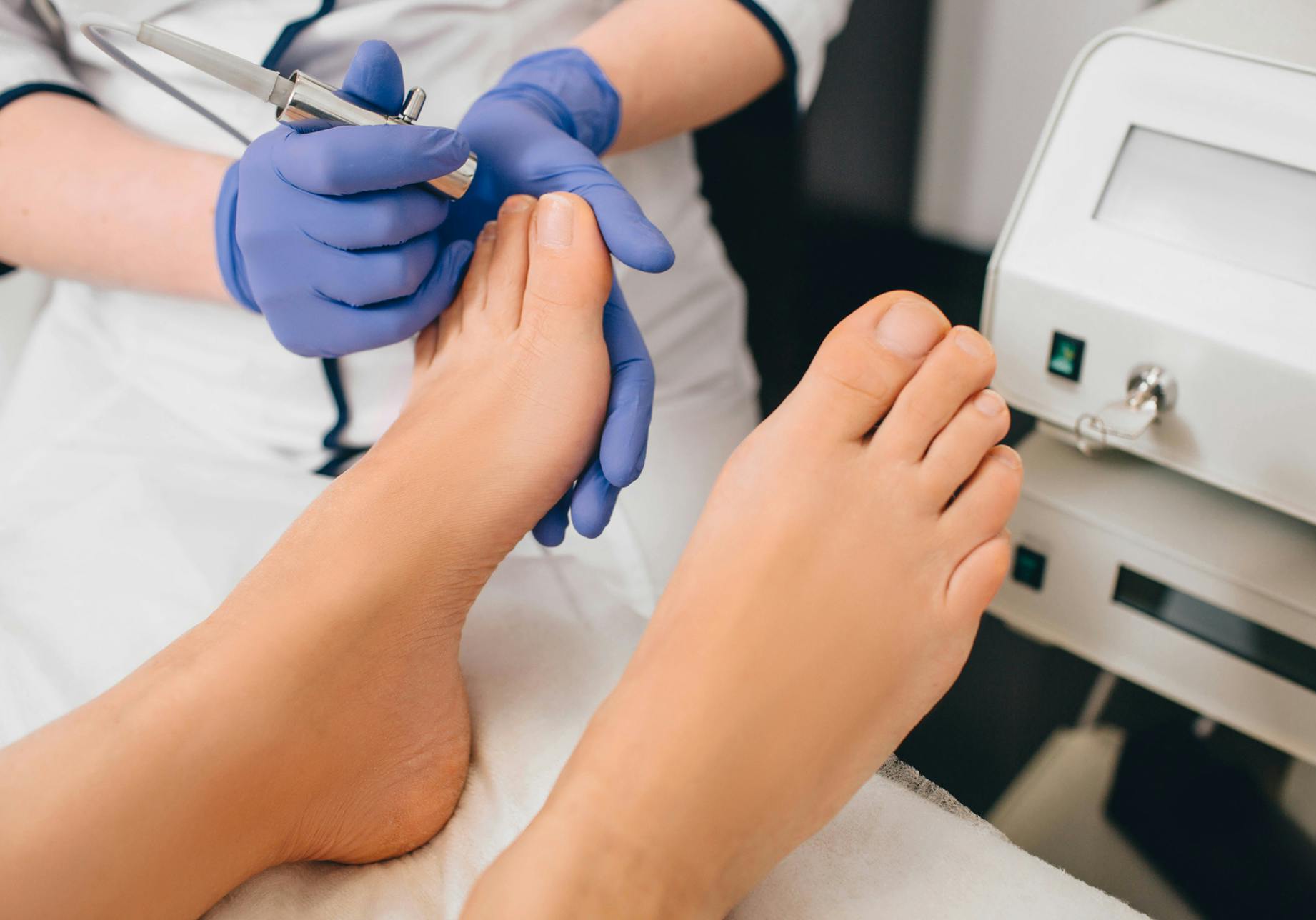 Patient having feet worked on by medical staff