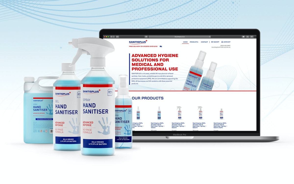 Sanitisplus bottles in front of the ecommerce website displayed on a macbook