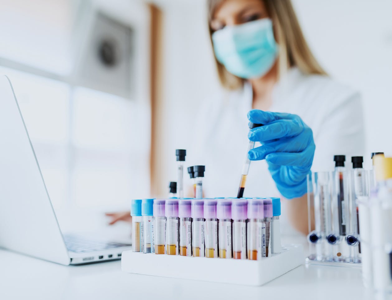 Doctor working with samples in viles