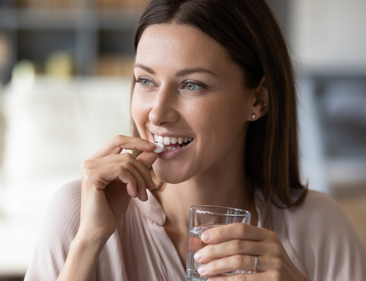 Woman taking a pill