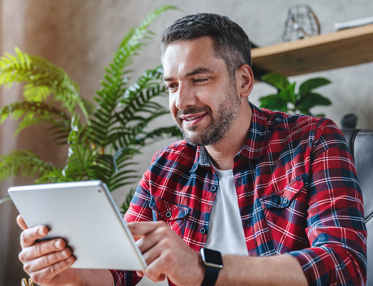 Man looking at an ipad