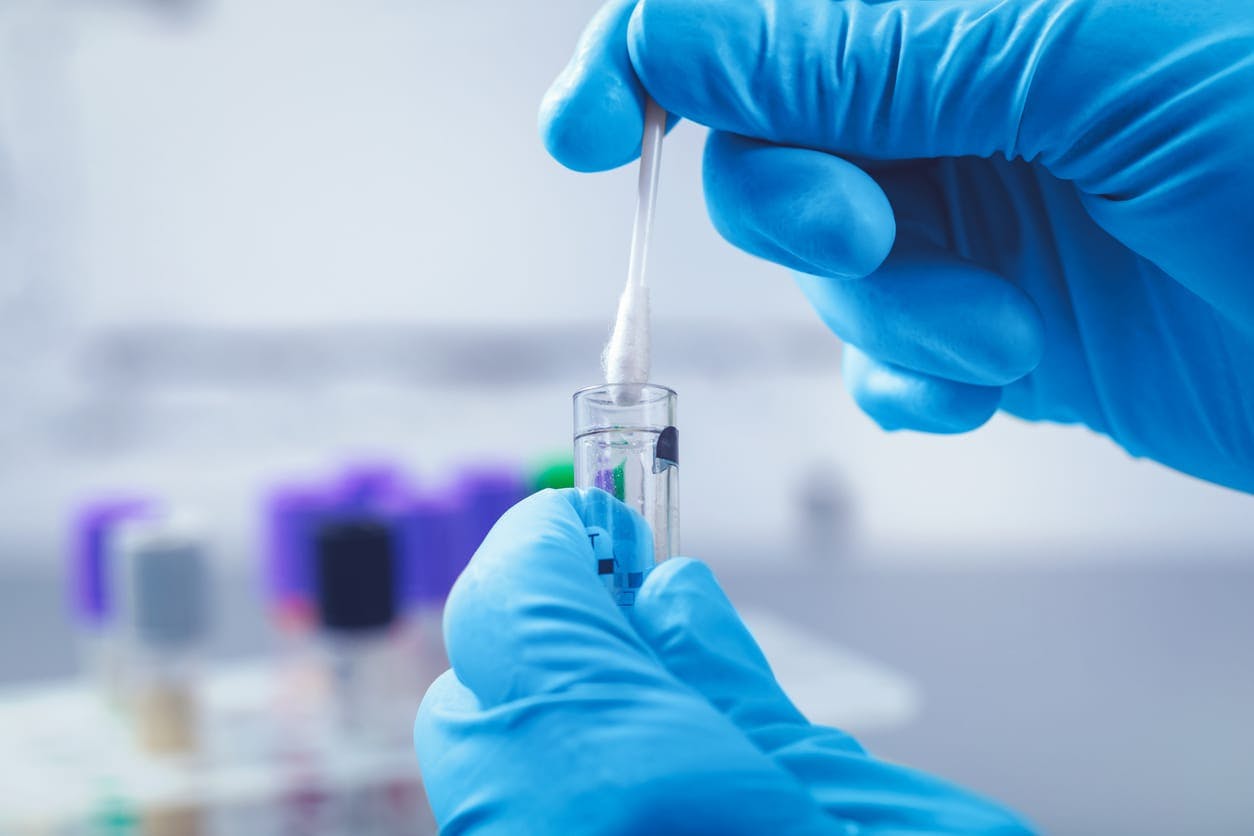 Scientist preparing sample swab