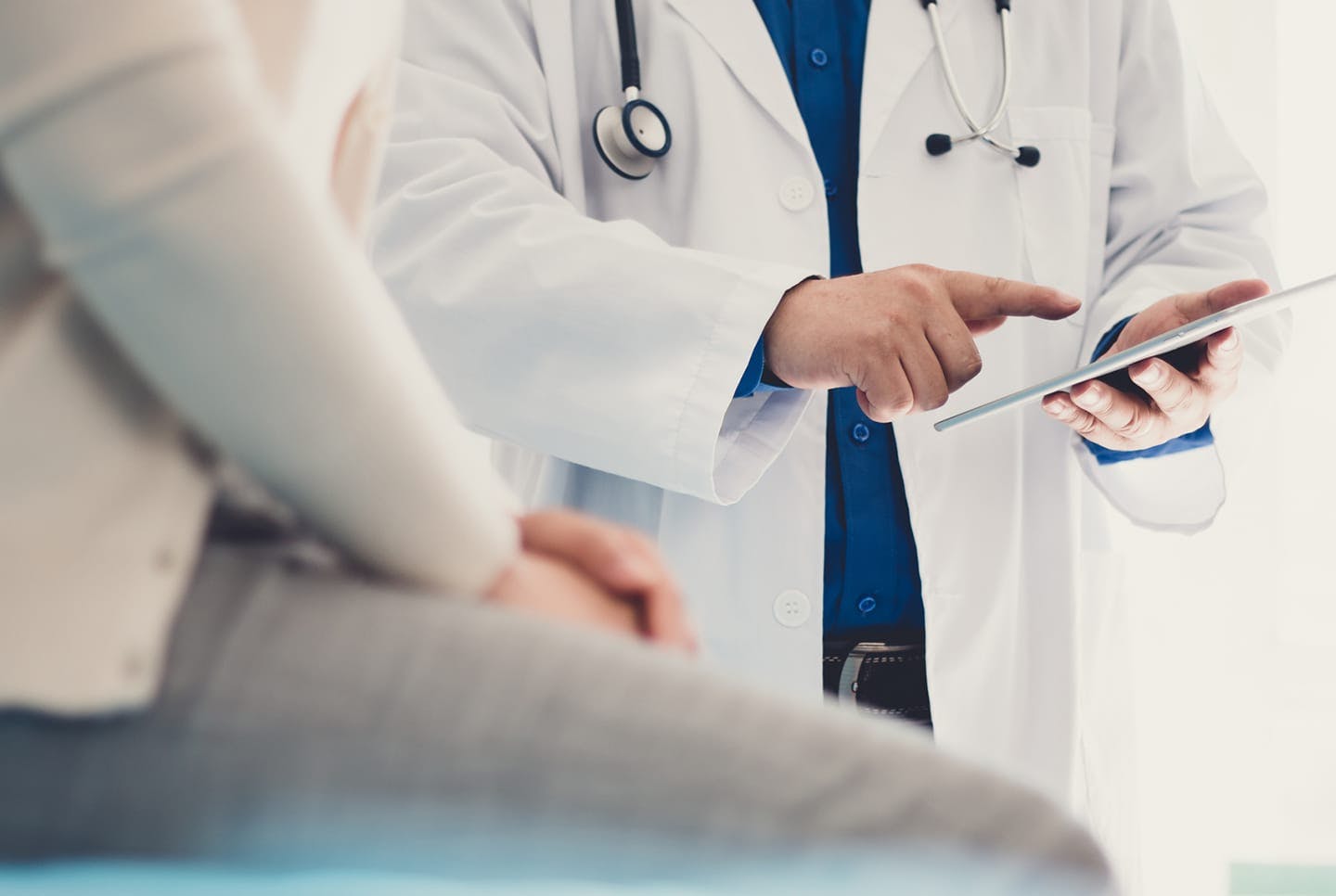 Doctor going over chart with patient